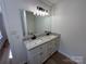 Bathroom with dual vanities, granite counters, modern fixtures, and large mirror at 2190 Pacer Rd, Lancaster, SC 29720