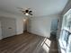 Spacious bedroom with hardwood floors, natural light, ceiling fan, and walk-in closet at 2190 Pacer Rd, Lancaster, SC 29720
