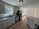 Updated kitchen featuring granite countertops, stainless steel appliances, and white cabinets, all bathed in natural light at 2190 Pacer Rd, Lancaster, SC 29720