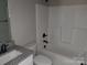 Bathroom featuring matching toilet, tub, vanity, granite countertops, and neutral-colored walls at 2200 Clay St # 2, Kannapolis, NC 28083