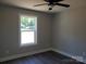 Bedroom featuring modern vinyl floors, neutral paint, a window, and a ceiling fan at 2200 Clay St # 2, Kannapolis, NC 28083