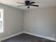 Bedroom featuring modern vinyl floors, neutral paint, a window, and a ceiling fan at 2200 Clay St # 2, Kannapolis, NC 28083