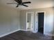 This bedroom features vinyl floors, fresh paint, ceiling fan, and ensuite bathroom access at 2200 Clay St # 2, Kannapolis, NC 28083