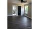 Comfortable bedroom features hardwood floors, a ceiling fan, and natural light at 2200 Clay St # 2, Kannapolis, NC 28083