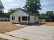 Charming home with white siding, new landscaping, and a spacious driveway at 2200 Clay St # 2, Kannapolis, NC 28083