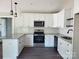 Modern kitchen features granite counters, white cabinets, and stainless steel appliances at 2200 Clay St # 2, Kannapolis, NC 28083