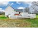 Backyard features a white wooden fence, a wooden ramp, and a light-colored hot tub at 2455 Wellridge Rd, Chester, SC 29706
