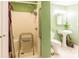 This bathroom features a walk-in shower with safety bars, toilet and pedestal sink at 2455 Wellridge Rd, Chester, SC 29706