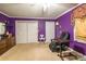 Spacious bedroom with purple walls, carpeting, and ceiling fan at 2455 Wellridge Rd, Chester, SC 29706