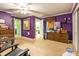 Large bedroom with purple walls, multiple closets, and comfortable carpeting at 2455 Wellridge Rd, Chester, SC 29706