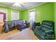 Cozy bedroom with green walls, a ceiling fan, and neutral carpet provides a peaceful retreat at 2455 Wellridge Rd, Chester, SC 29706