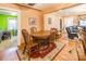 Open-concept dining room with hardwood floors, traditional furniture, and warm lighting at 2455 Wellridge Rd, Chester, SC 29706
