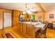 Open kitchen featuring a large island, wooden cabinetry, stainless steel appliances, and tile floors at 2455 Wellridge Rd, Chester, SC 29706