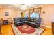 The living room features a plush leather sectional, hardwood floors, and natural light from a large window at 2455 Wellridge Rd, Chester, SC 29706