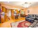 Living room with an open floor plan, hardwood floors, and a seamless transition into the dining area at 2455 Wellridge Rd, Chester, SC 29706