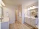 Bright and spacious bathroom featuring dual vanities and neutral tile flooring at 2538 Cherry Bark Oak Ct, Gastonia, NC 28056