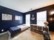 Navy bedroom with natural light, a bed, study area, and decorative accents at 2538 Cherry Bark Oak Ct, Gastonia, NC 28056