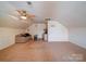 Bonus room with pitched ceiling, carpet, ceiling fan, sofa and table/chairs at 2538 Cherry Bark Oak Ct, Gastonia, NC 28056