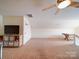 Bonus room with pitched ceiling, carpet, ceiling fan, and wall-mounted TV at 2538 Cherry Bark Oak Ct, Gastonia, NC 28056