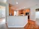 Stylish kitchen with wood cabinets, granite countertops, and stainless steel oven at 2538 Cherry Bark Oak Ct, Gastonia, NC 28056