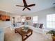 Spacious living room with large sectional, open to kitchen and dining areas at 2538 Cherry Bark Oak Ct, Gastonia, NC 28056