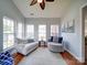 Cozy sunroom with hardwood floors, neutral walls, and natural light at 2538 Cherry Bark Oak Ct, Gastonia, NC 28056
