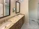 Bathroom featuring double sinks, granite counters, and modern fixtures at 2927 Clemson Ave, Charlotte, NC 28205