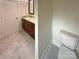 Charming bathroom features modern fixtures, a sleek vanity, and a toilet at 2927 Clemson Ave, Charlotte, NC 28205