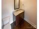 Bathroom features a modern vanity with a granite countertop and a sleek sink at 2927 Clemson Ave, Charlotte, NC 28205