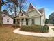 Charming home with a unique roofline, covered porch, and manicured landscaping at 2927 Clemson Ave, Charlotte, NC 28205