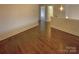 Cozy upstairs hallway with hardwood floors and access to multiple rooms at 2927 Clemson Ave, Charlotte, NC 28205