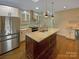 Modern kitchen with stainless steel appliances and large island at 2927 Clemson Ave, Charlotte, NC 28205
