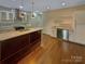 Beautiful kitchen features an island, stainless steel appliances, and custom cabinetry at 2927 Clemson Ave, Charlotte, NC 28205