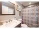 Bathroom with a vanity, toilet, gray walls, and a patterned shower curtain at 30 Hillsboro Rd, Taylorsville, NC 28681