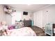 Charming ' bedroom with gray walls, modern floors, window, and a closet at 30 Hillsboro Rd, Taylorsville, NC 28681