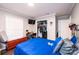 Large bedroom includes wood-look floors, closet space, a window, and neutral gray walls at 30 Hillsboro Rd, Taylorsville, NC 28681