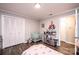 Bedroom showcasing a crib and modern toys with natural light, and closet space at 30 Hillsboro Rd, Taylorsville, NC 28681