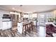 Bright kitchen featuring stainless steel appliances, a center island, and access to the backyard at 30 Hillsboro Rd, Taylorsville, NC 28681