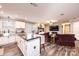 Spacious living area featuring a well-equipped kitchen island, cozy lounge furniture, and a classic brick fireplace at 30 Hillsboro Rd, Taylorsville, NC 28681