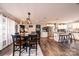 The dining area seamlessly flows into a well-equipped kitchen with a central island, enhancing the home's open design at 30 Hillsboro Rd, Taylorsville, NC 28681
