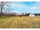 Expansive property showcasing the main house and a detached garage with ample yard space at 30 Hillsboro Rd, Taylorsville, NC 28681