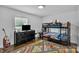 bedroom with bunk beds, dark wood floors, a street map rug, and a large window at 3036 Marlowe Ave, Charlotte, NC 28208