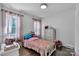 Comfortable bedroom with hardwood floors, soft lighting, and ample natural light at 3036 Marlowe Ave, Charlotte, NC 28208