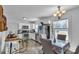 Bright eat-in kitchen with stainless steel appliances, white cabinets, natural light and tile floors at 3036 Marlowe Ave, Charlotte, NC 28208