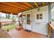 Charming back porch with wooden floors, black railings, and a covered structure at 3901 Durham Ln, Charlotte, NC 28269