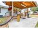 Backyard featuring a covered deck, a concrete slab, and mature trees in a neighborhood at 3901 Durham Ln, Charlotte, NC 28269