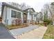 Charming single-story home featuring stone-accented porch columns and beautifully landscaped walkway at 3901 Durham Ln, Charlotte, NC 28269