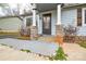 Close-up of the home's entrance, highlighting the stone-supported porch columns and tidy walkway at 3901 Durham Ln, Charlotte, NC 28269