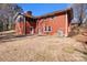 Spacious backyard of brick home with patio at 407 Pinecroft Ln, Spencer, NC 28159