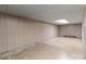 Unfinished basement area with paneled walls and a low ceiling with recessed lighting at 407 Pinecroft Ln, Spencer, NC 28159